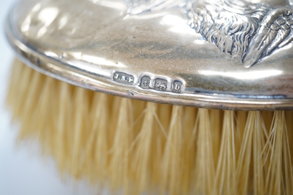 An Edwardian silver mounted four piece mirror and brush set, Birmingham, 1901. Condition - poor